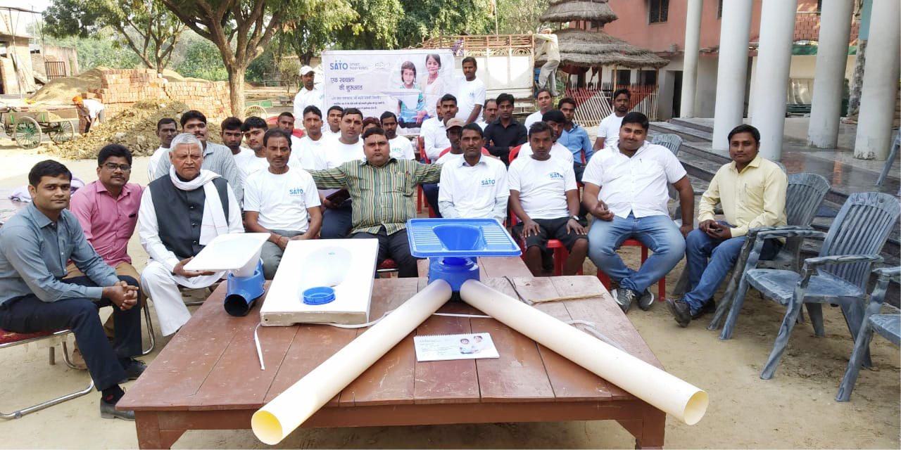 Dr. Tiwari & his team attending a SATO training session on the toilet installation process