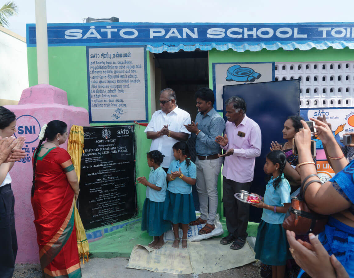 Subburaman celebrates the opening of a new block of SATO toilets in a local primary school.